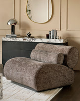 Sofia accent chair in mocha fabric with curved cylindrical design, displayed in a styled living room setting.