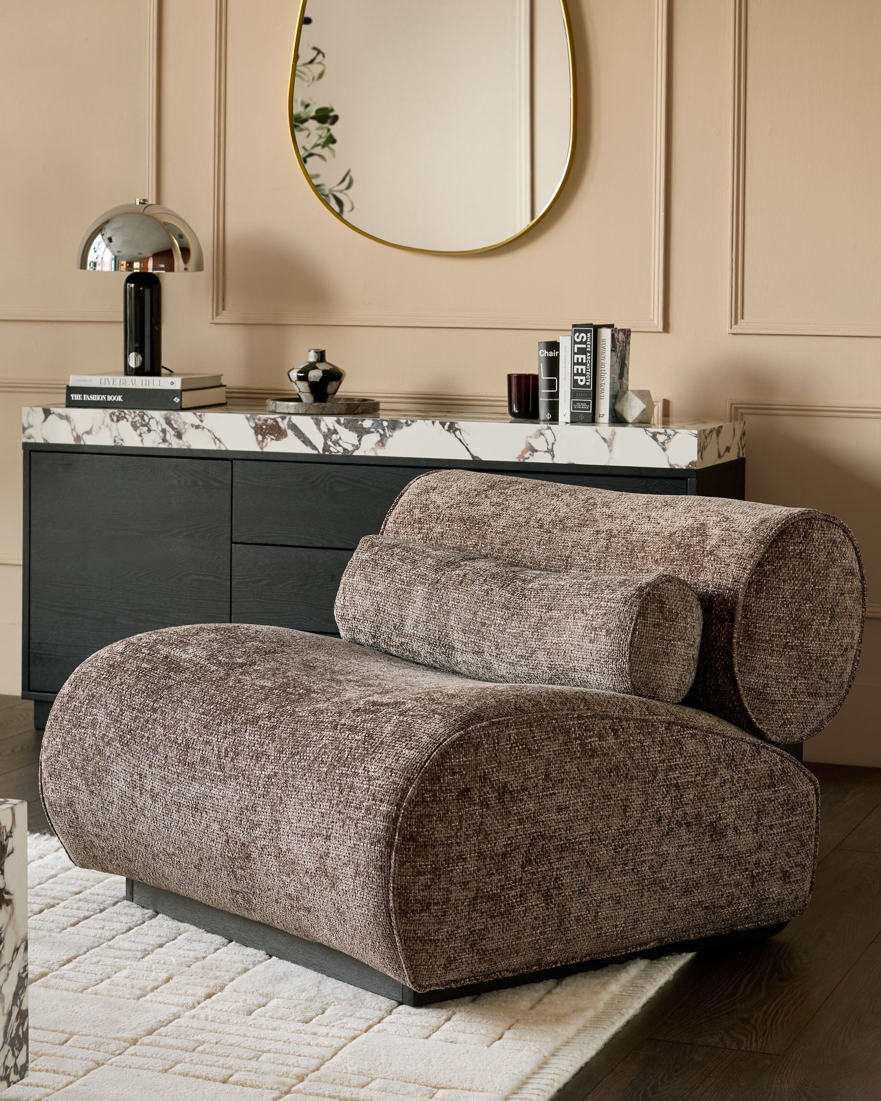 Sofia accent chair in mocha fabric with curved cylindrical design, displayed in a styled living room setting.
