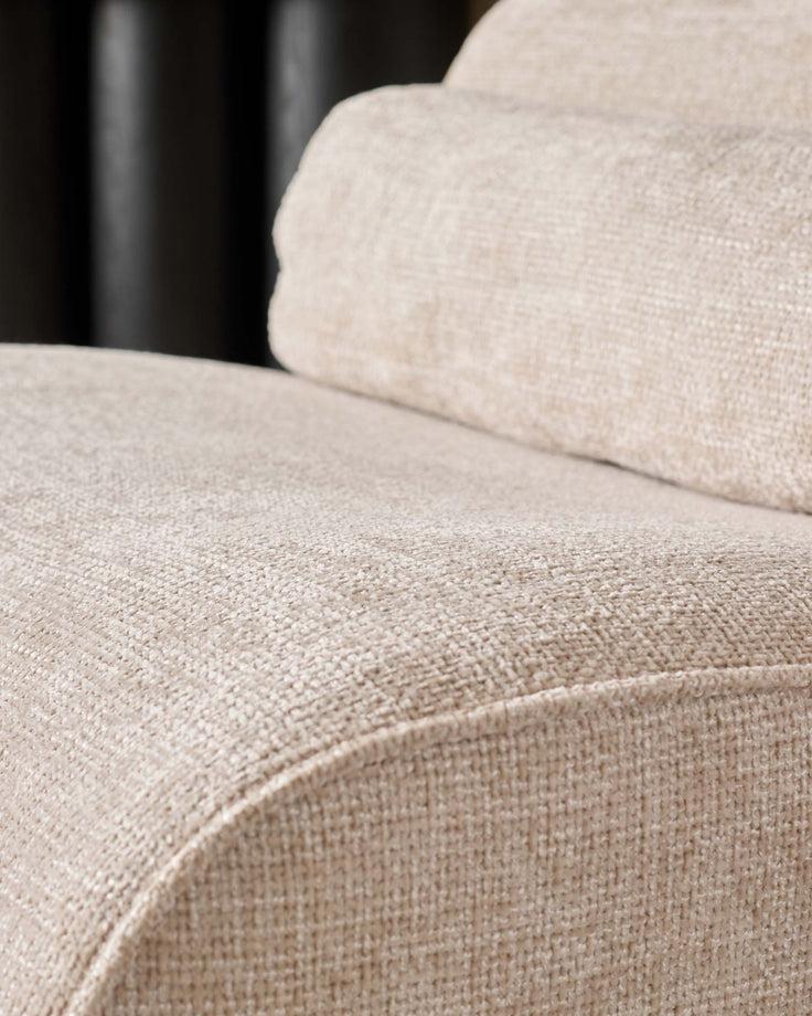Sofia 2-seater sofa in natural fabric, close-up showing woven texture and seaming detail.