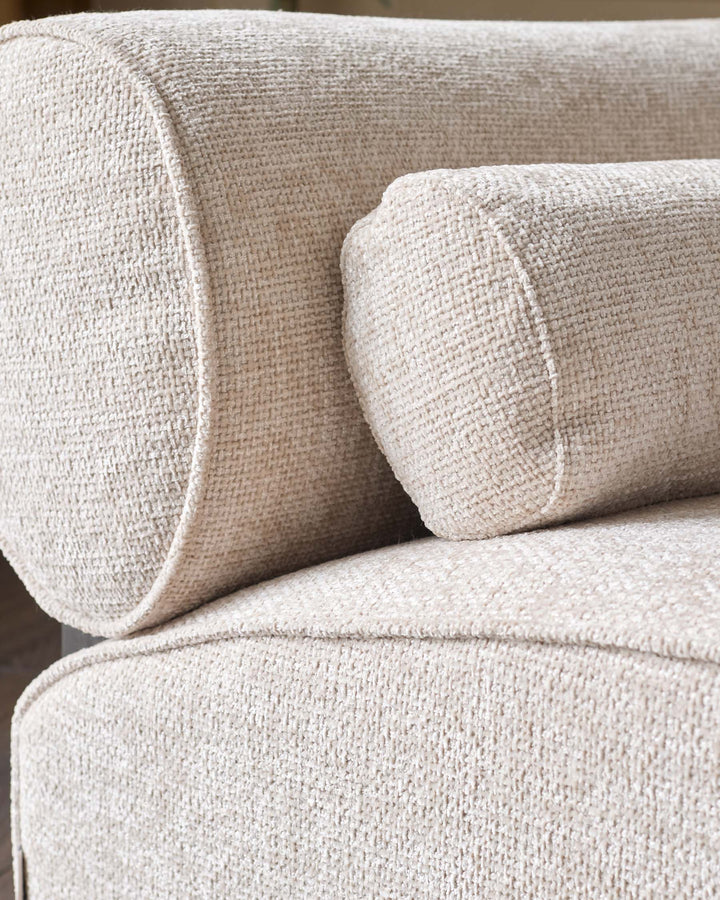 Sofia 2-seater sofa in natural fabric, close-up detail showing textured weave and curved armrest design.