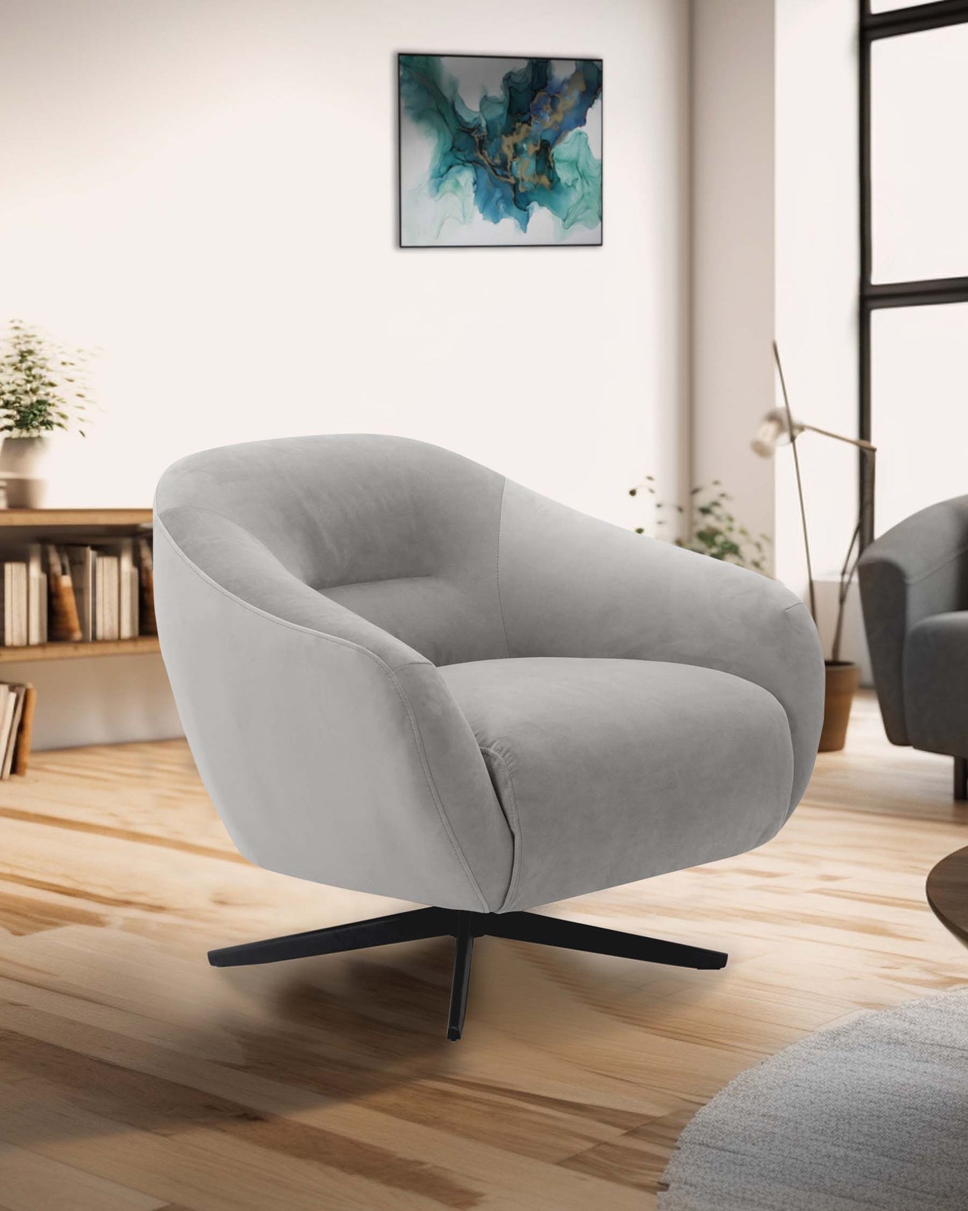 A contemporary light grey armchair with a unique curved design and a four-pronged black metal base, positioned on a wooden floor in a modern living room setting.