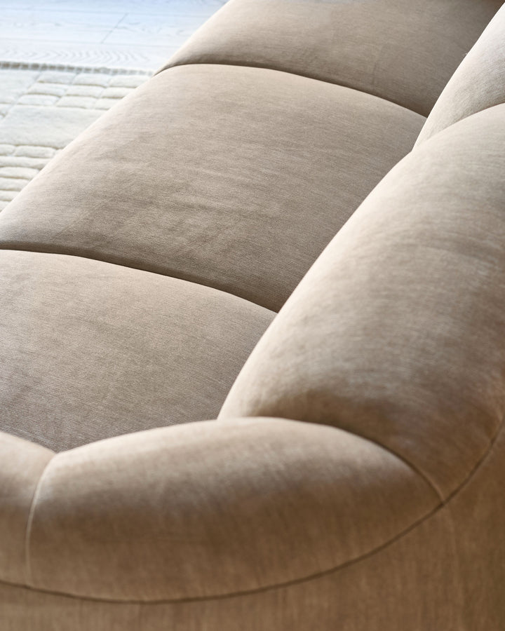 Teagan 3-seater sofa in champagne fabric, close-up detail showing plush cushioning and soft upholstery texture.