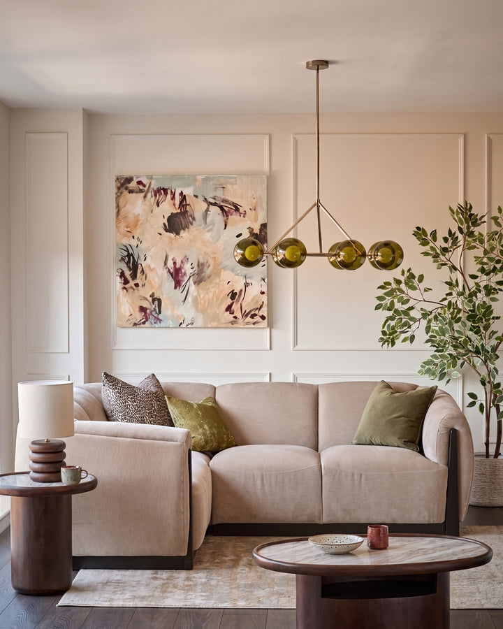 Teagan left-hand small corner sofa in champagne fabric, shown in a styled living room setting.