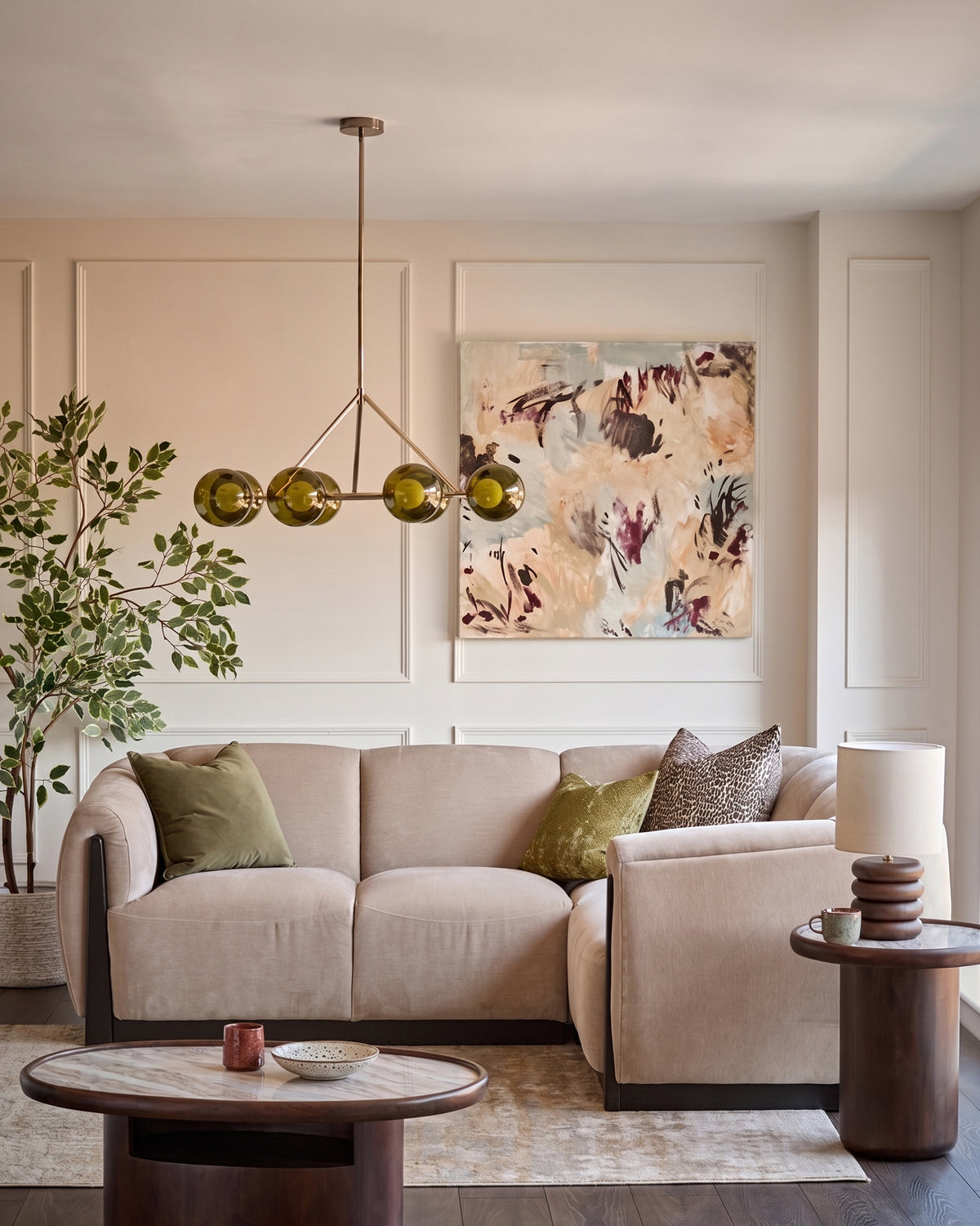 Champagne fabric right-hand small corner sofa in a modern living room setting with coordinating armchair and wooden accents.