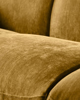 Close-up of ochre fabric on Teagan 2-seater sofa, showing texture and cushioned seating detail.