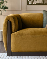 Teagan 2-seater sofa in ochre fabric with dark wood frame and rolled armrests, side angle view.