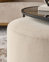 Thea smoked mirror coffee table and cream fabric pouffe set