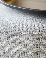 Thea smoked mirror coffee table and light grey fabric pouffe set