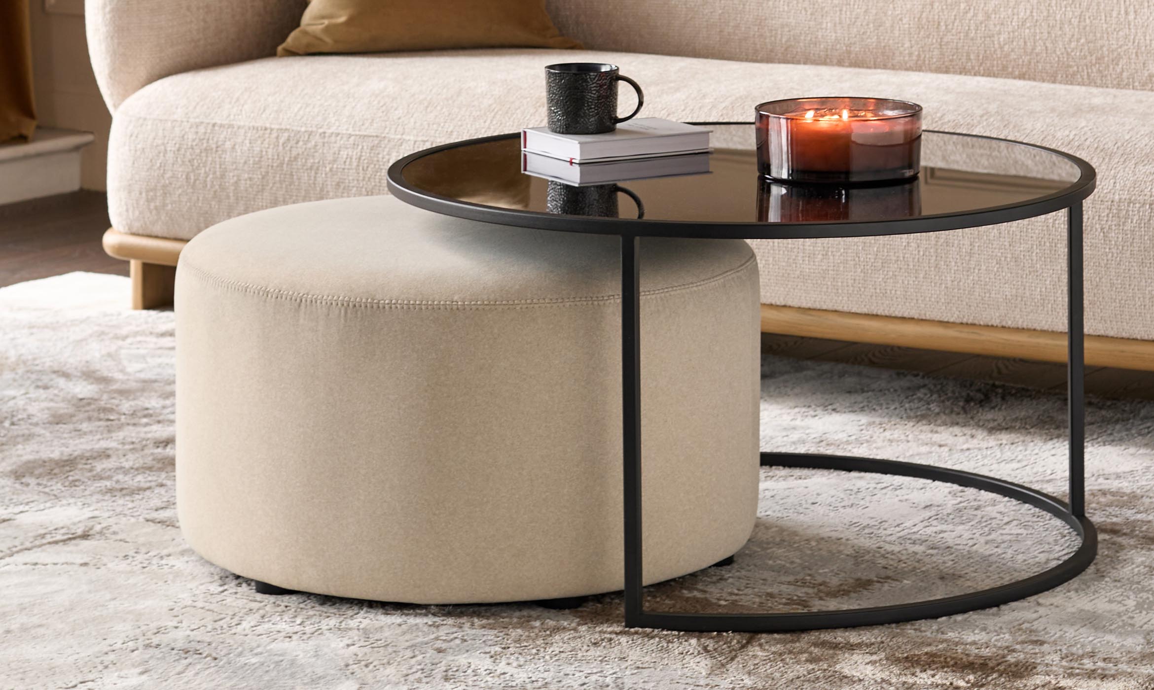 Thea smoked mirror coffee table and cream fabric pouffe set