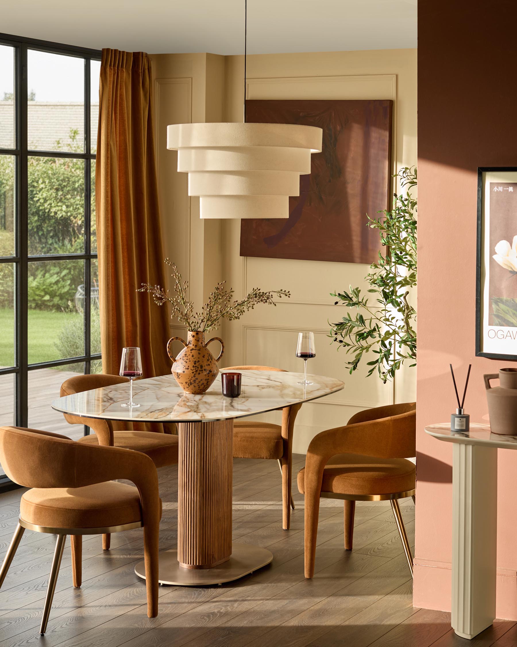 Vidal 6-seater dining table with natural ceramic top and fluted wood base in a warm dining room setting.