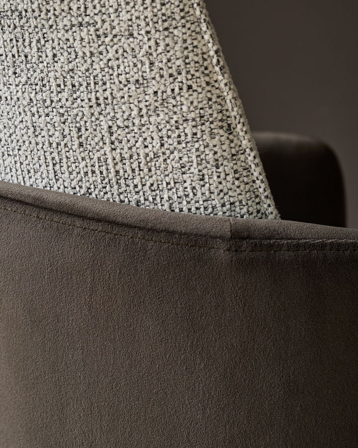 Grey velvet seat with light textured fabric backrest detail.