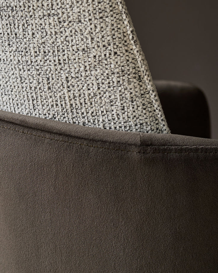 Grey velvet seat with light textured fabric backrest detail.