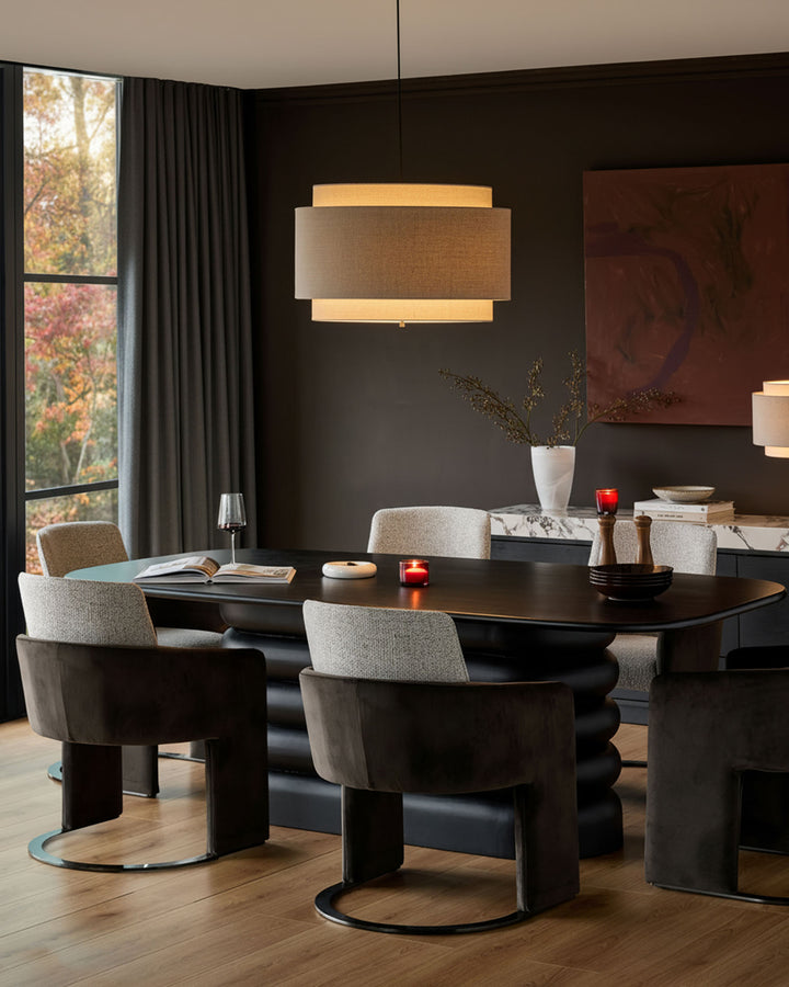 Wren cantilever dining chair in grey fabric and dark chocolate finish, shown in modern dining room setting.