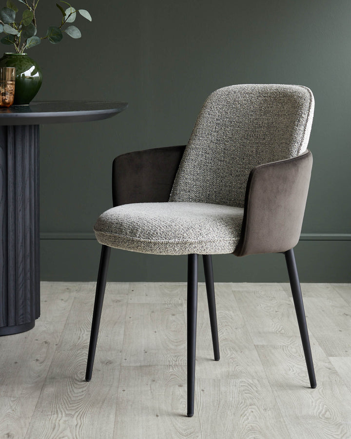 Stylish chair with tweed seat and back, and dark brown armrests and legs, adding sophistication to any dining space.