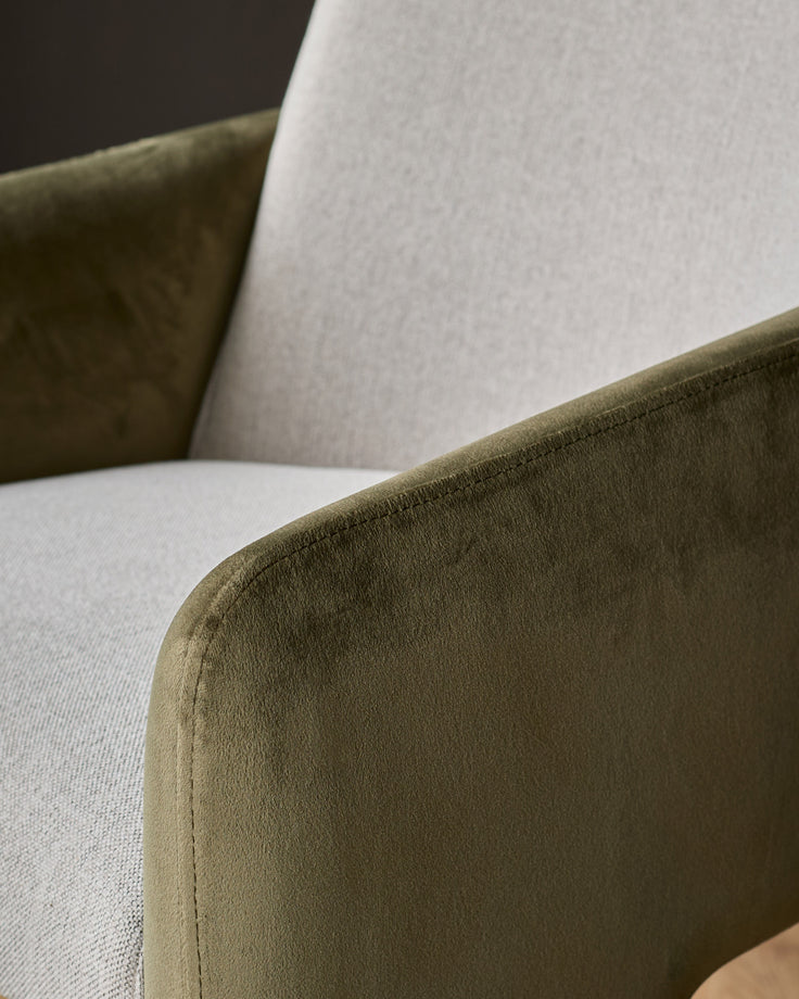 Wren dining chair detail showing olive-green velvet armrest against natural fabric seat and backrest.