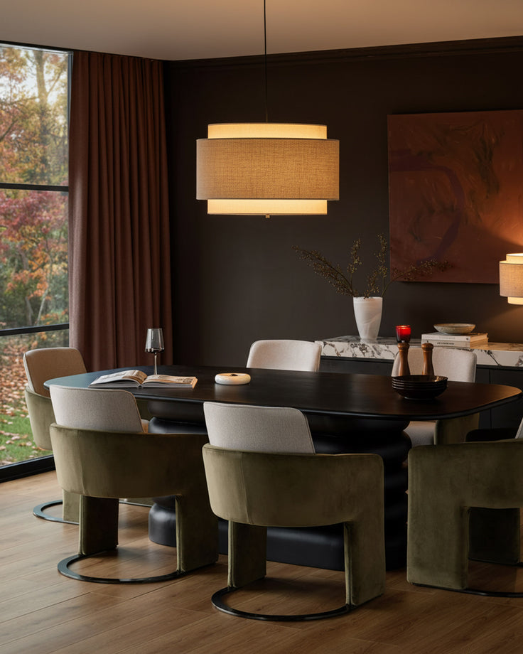 Wren cantilever dining chair in natural and olive green velvet, shown in a modern dining room setting.