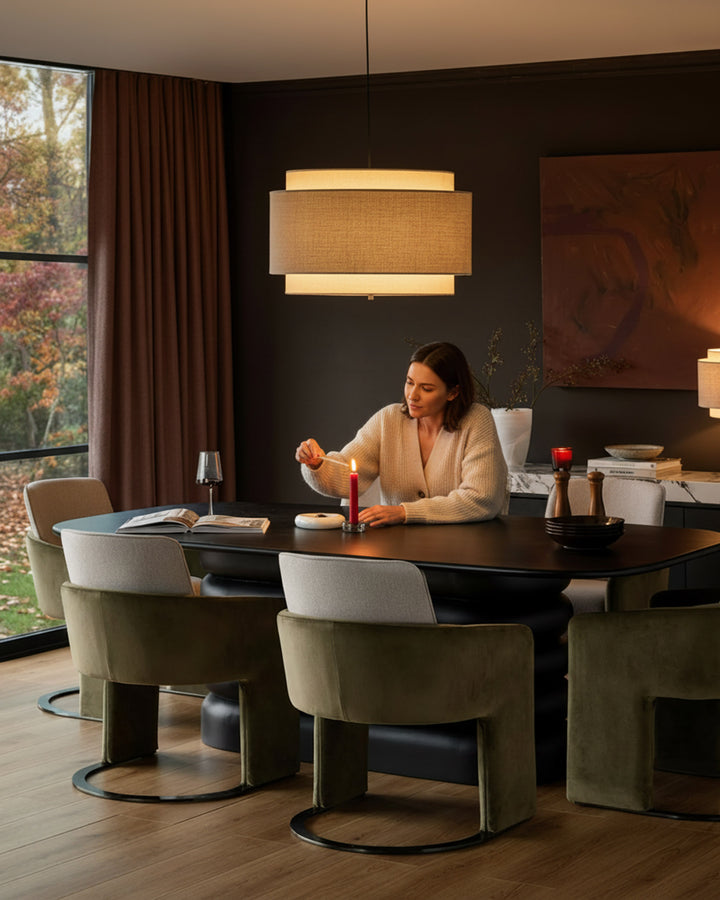 Wren Cantilever Dining Chair in natural and olive green velvet, shown in modern dining room setting.
