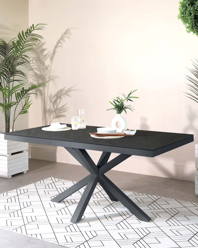 Modern rectangular dining table with a black stone tabletop and a geometric metal base in a dark matte finish.