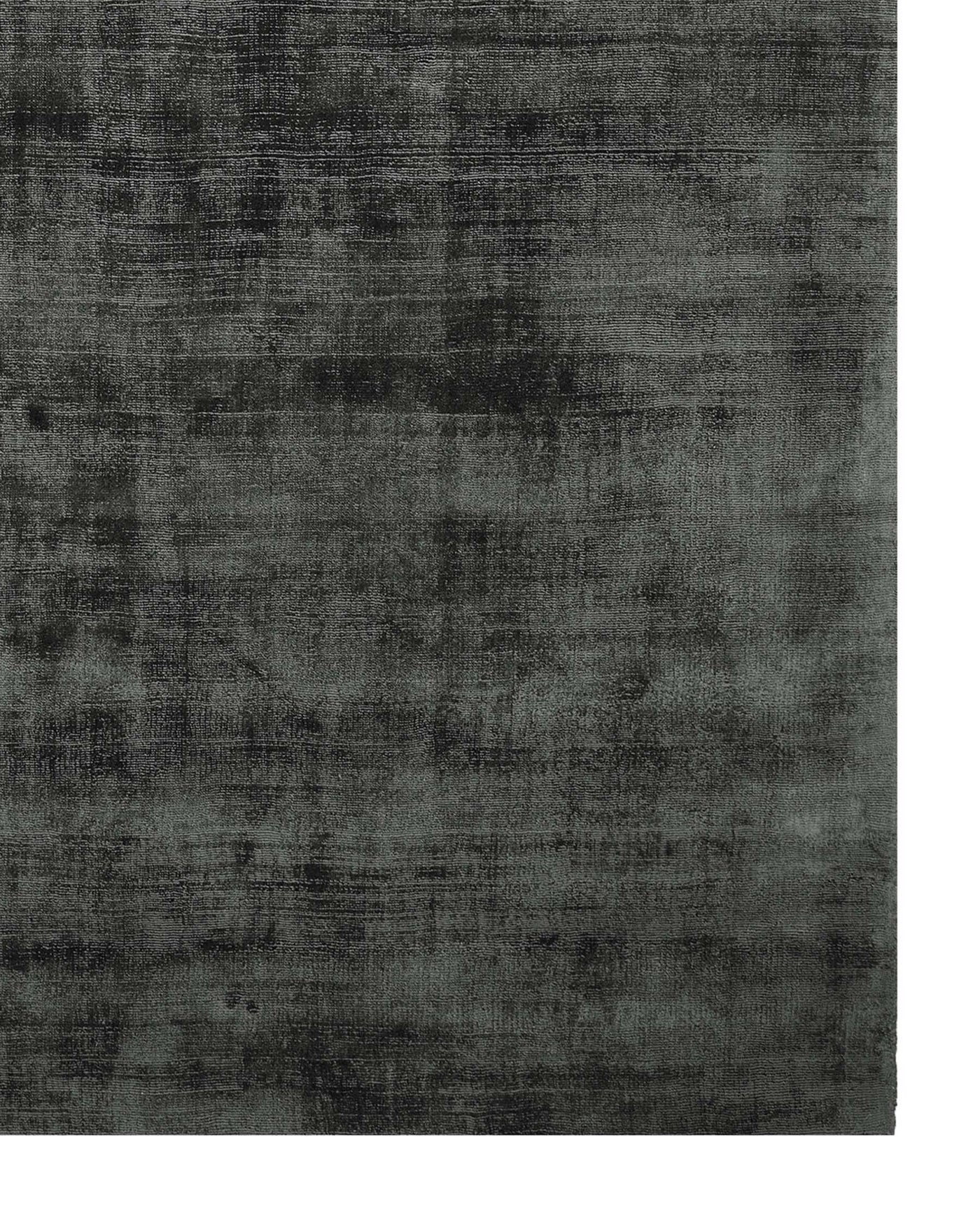 Contemporary distressed-style area rug in varying shades of grey.
