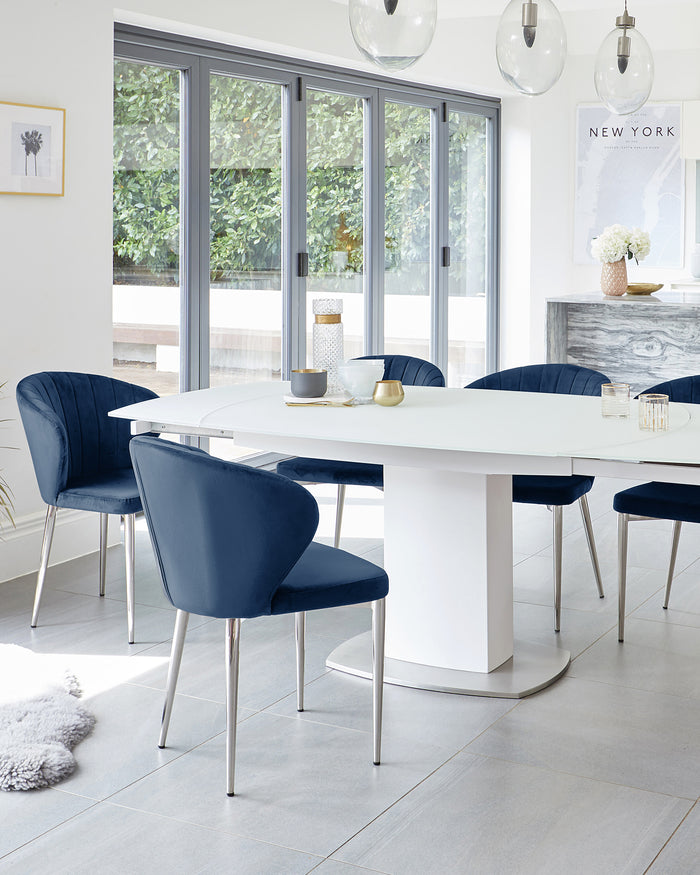 Camillo White Extending Table With Harper Sapphire Blue Velvet Chairs