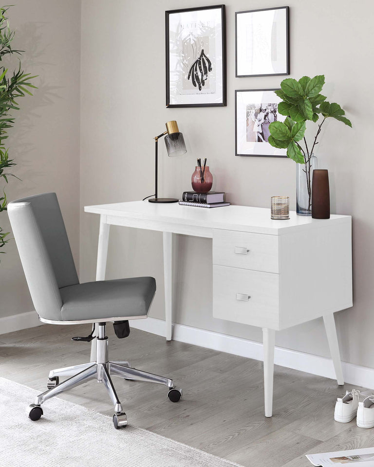 White modern minimalist desk with two drawers, paired with a grey upholstered office chair featuring a chrome five-star base with casters.