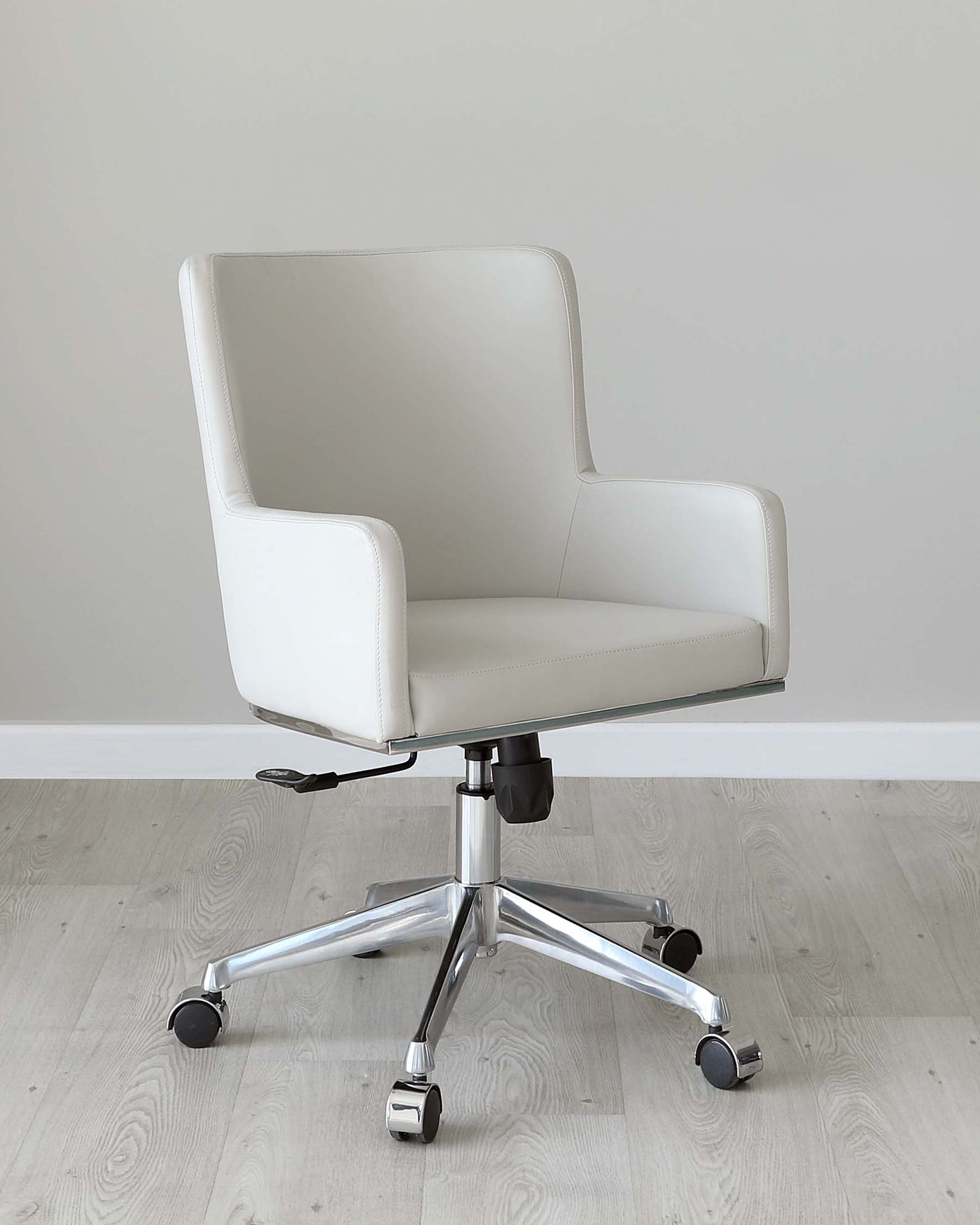 Modern white office chair with a high back, armrests, and chrome swivel base with casters.