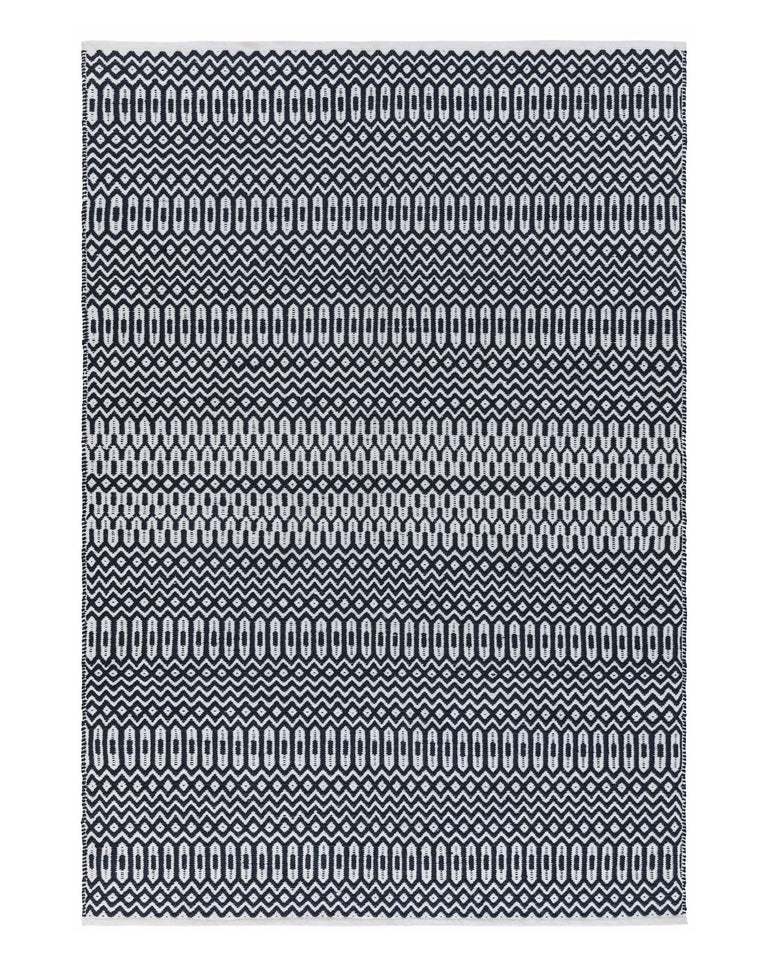 Contemporary black and white patterned area rug.