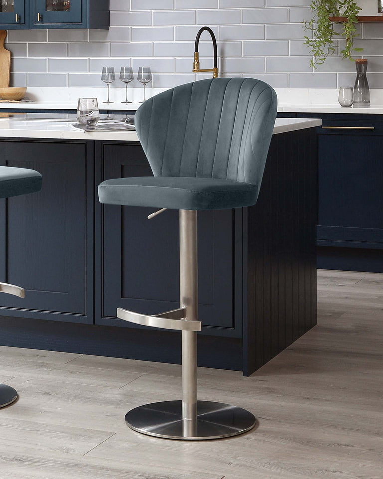 Elegant contemporary bar stool with plush, teal velvet upholstery, vertical channel tufting on the curved backrest, and chrome-finished pedestal base with footrest and adjustable height.