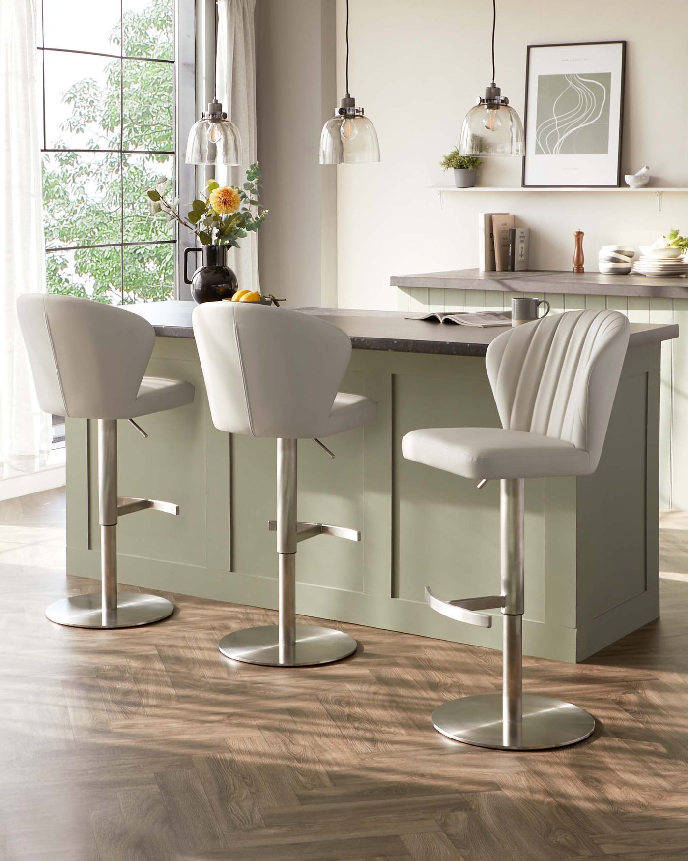 Three modern adjustable-height bar stools with white padded seats and backrests, fluted design detailing, and circular chrome bases.