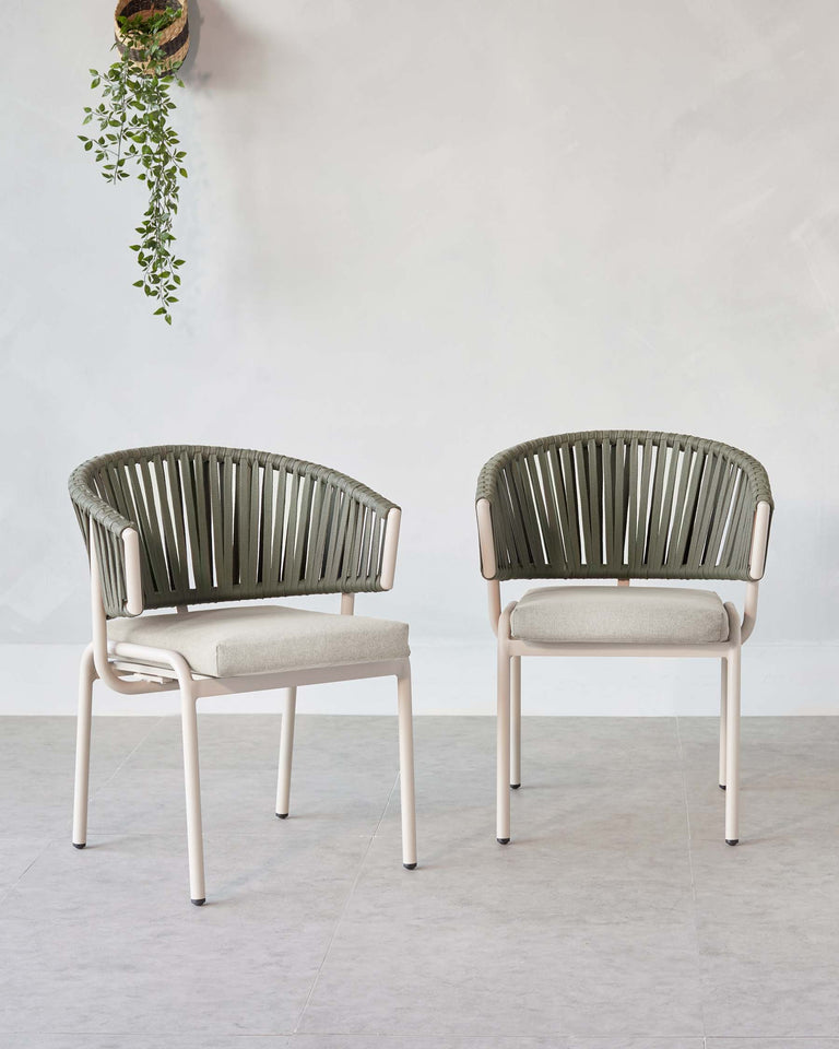 Two modern-style olive green accent chairs with vertical backrest ribbing and light beige cushioned seats, supported by sleek white metal frames.
