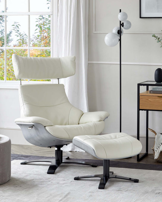Modern light beige leather recliner chair with adjustable headrest and matching footstool on a star-shaped black base, situated in a bright room with a white floor lamp and minimalist wooden side table in the background.