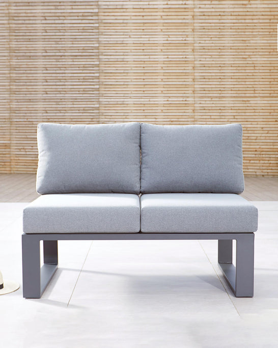 Modern two-seat sofa with a minimalist design, featuring a sleek grey metal frame and light grey cushioned seats and backrest. The sofa has clean lines and a contemporary look, suitable for a variety of interior design styles. Perfect for a chic living room or office space.