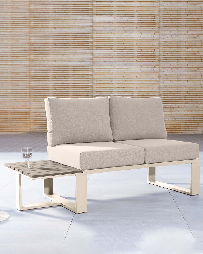 Modern two-seater sofa with a sleek beige metal frame and plush, neutral-toned cushions, accompanied by a matching metal-frame coffee table with a wooden slat top, displayed against a textured bamboo background.