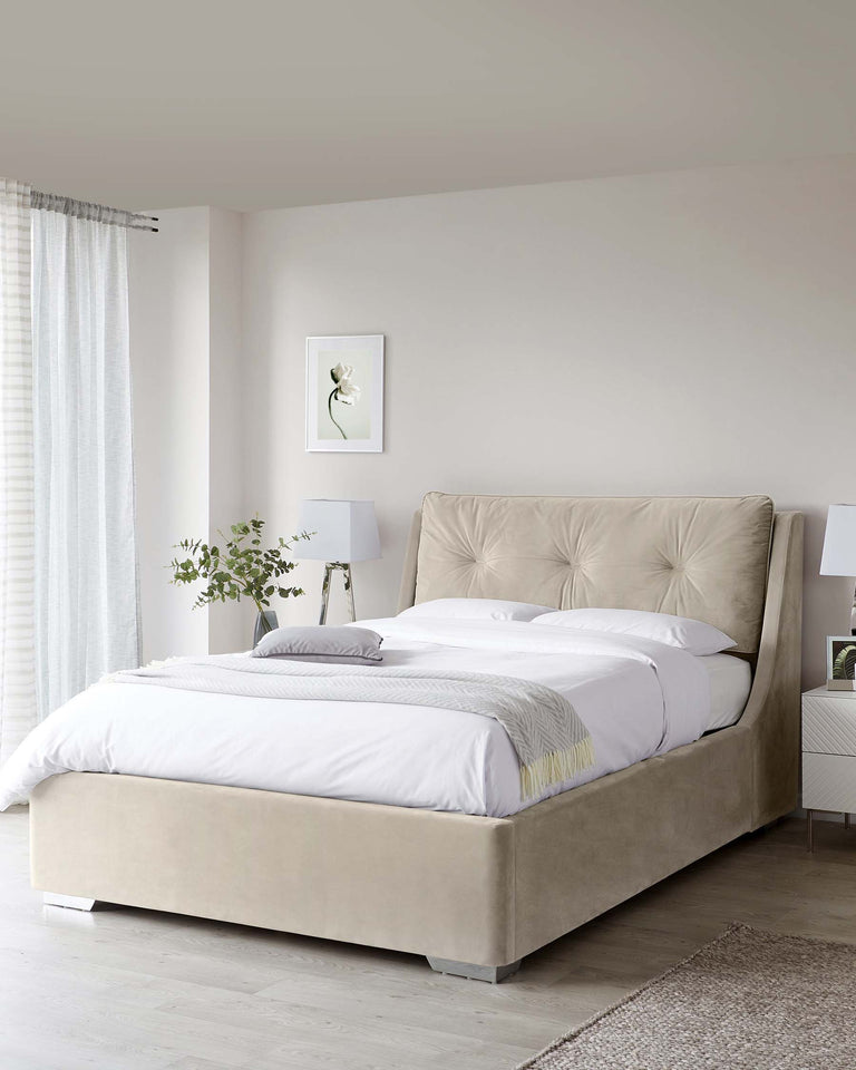 Elegant upholstered king-size bed with a tall, tufted headboard and neutral beige fabric, accompanied by two matching white nightstands with lamps.
