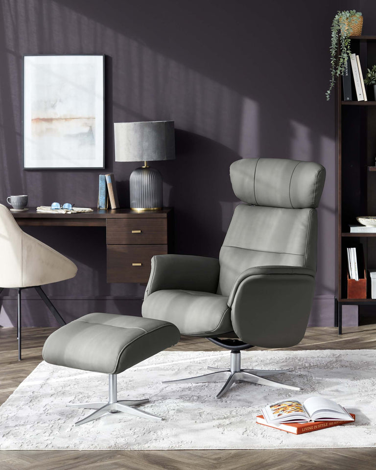 Modern grey leather recliner chair with matching footstool, featuring a sleek metal base, showcased in a stylish living room with elegant decor, standing on a plush white area rug.