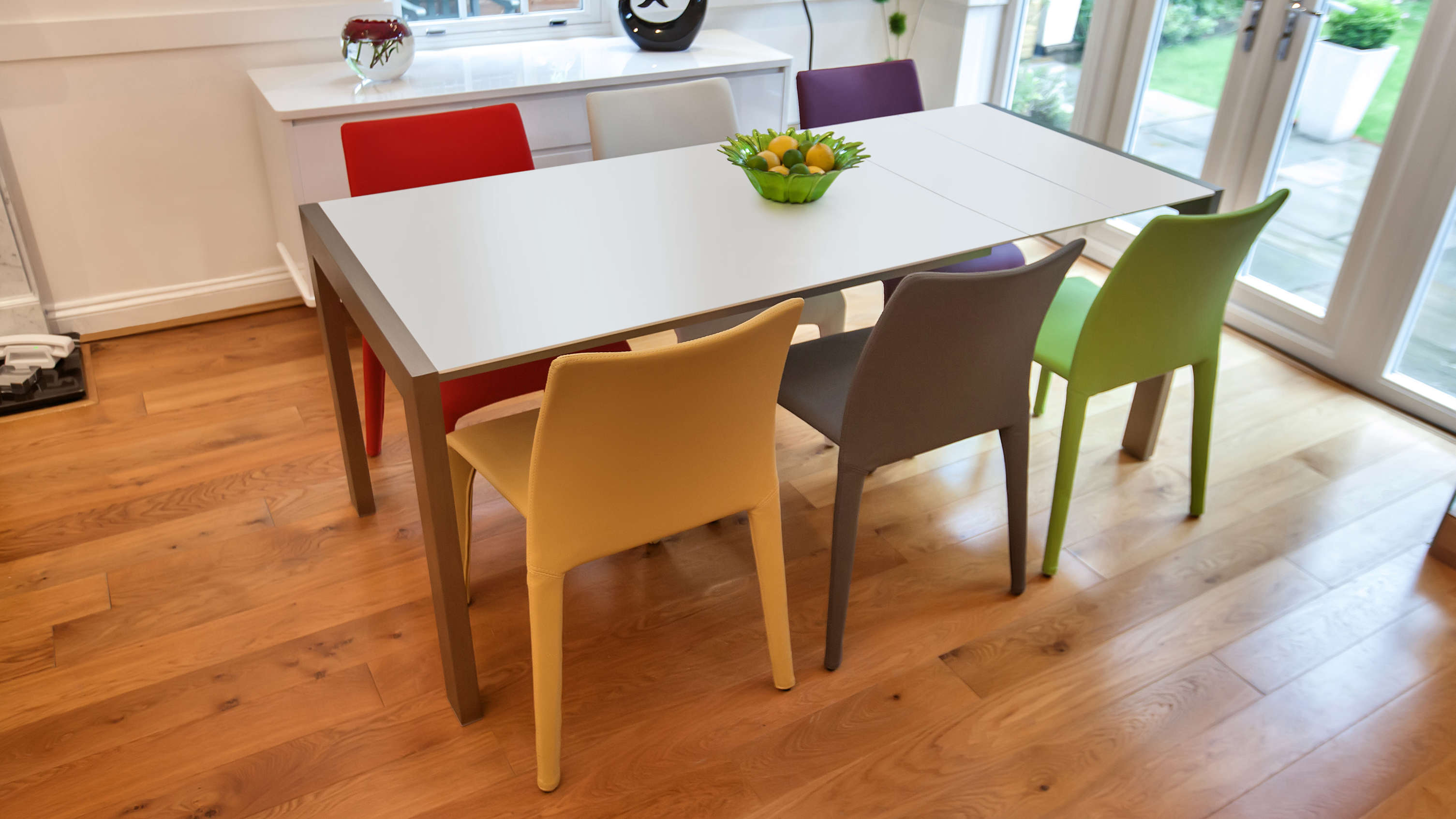 Coloured Dining Chairs and Matt White Extending Dining Table