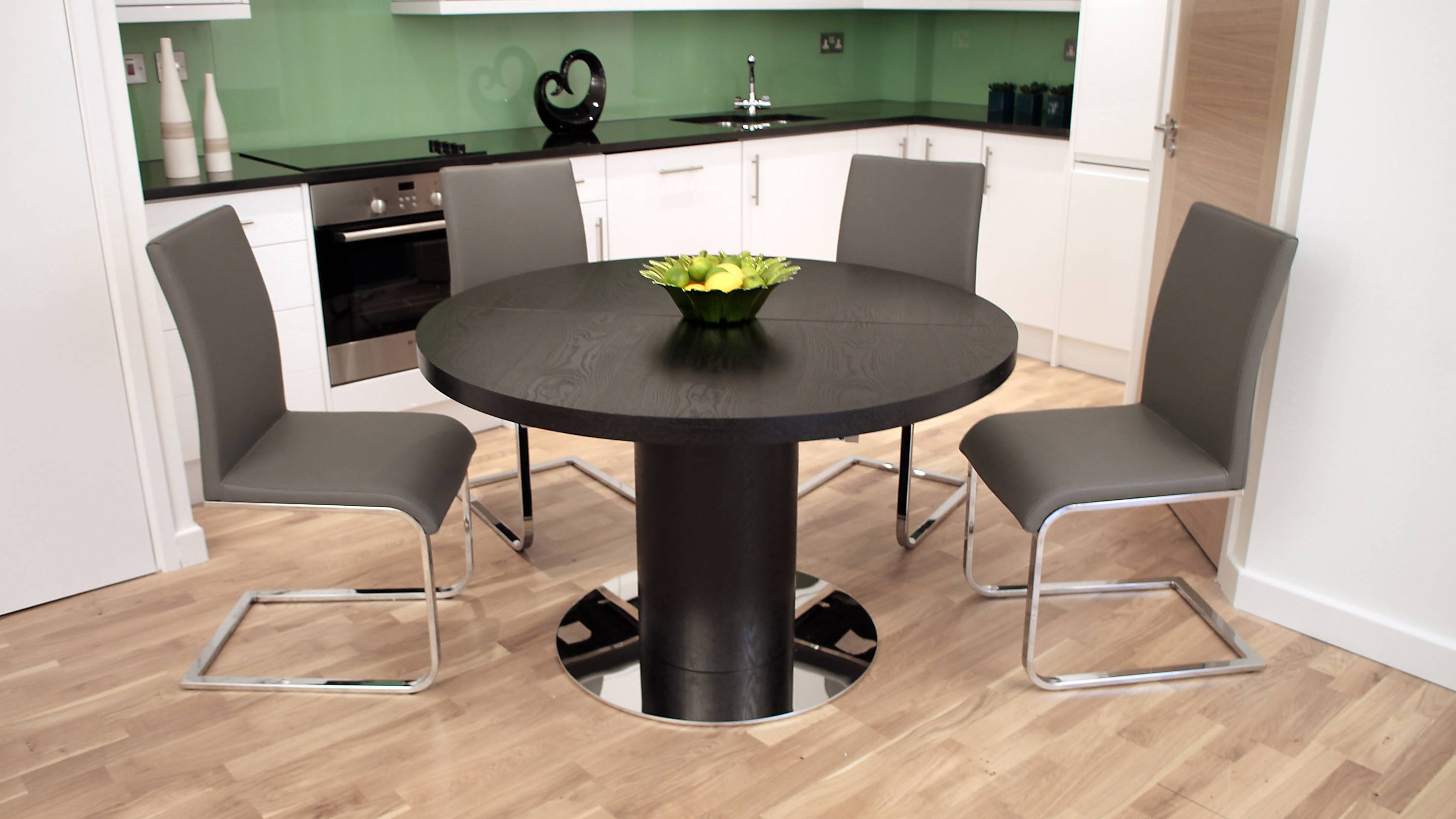Grey Cantilever Dining Chairs and Round Extending Dining Table