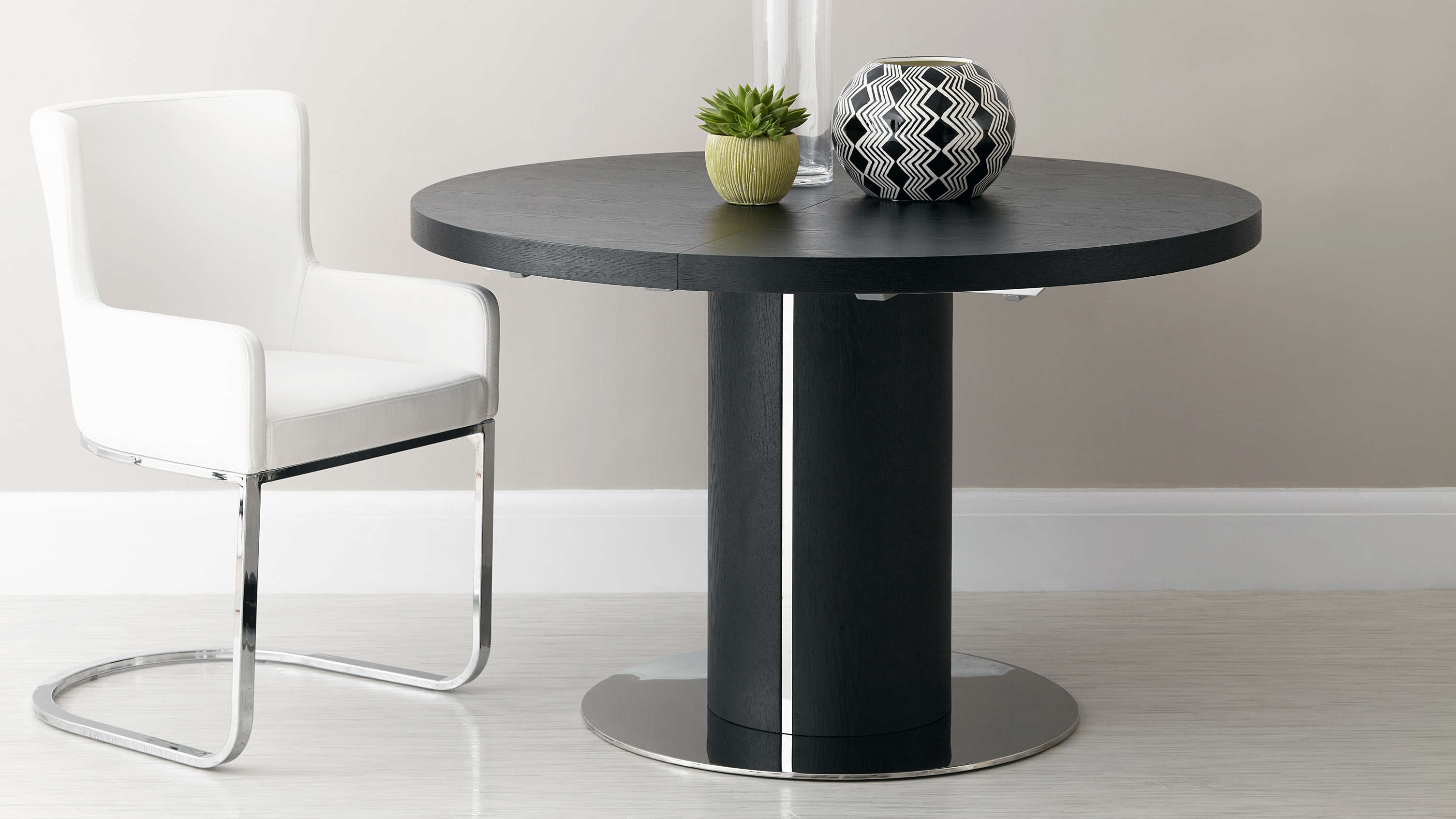 curva round black ash extending dining table