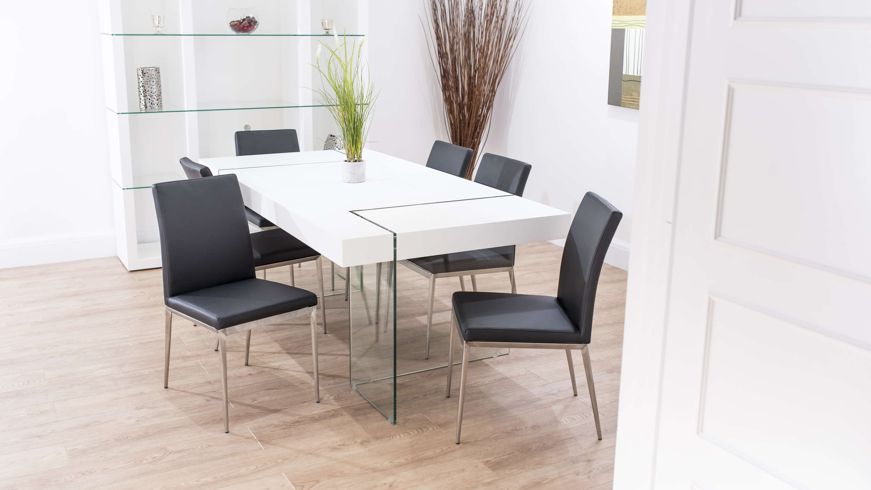 Black Dining Chairs and White Floating Dining Table